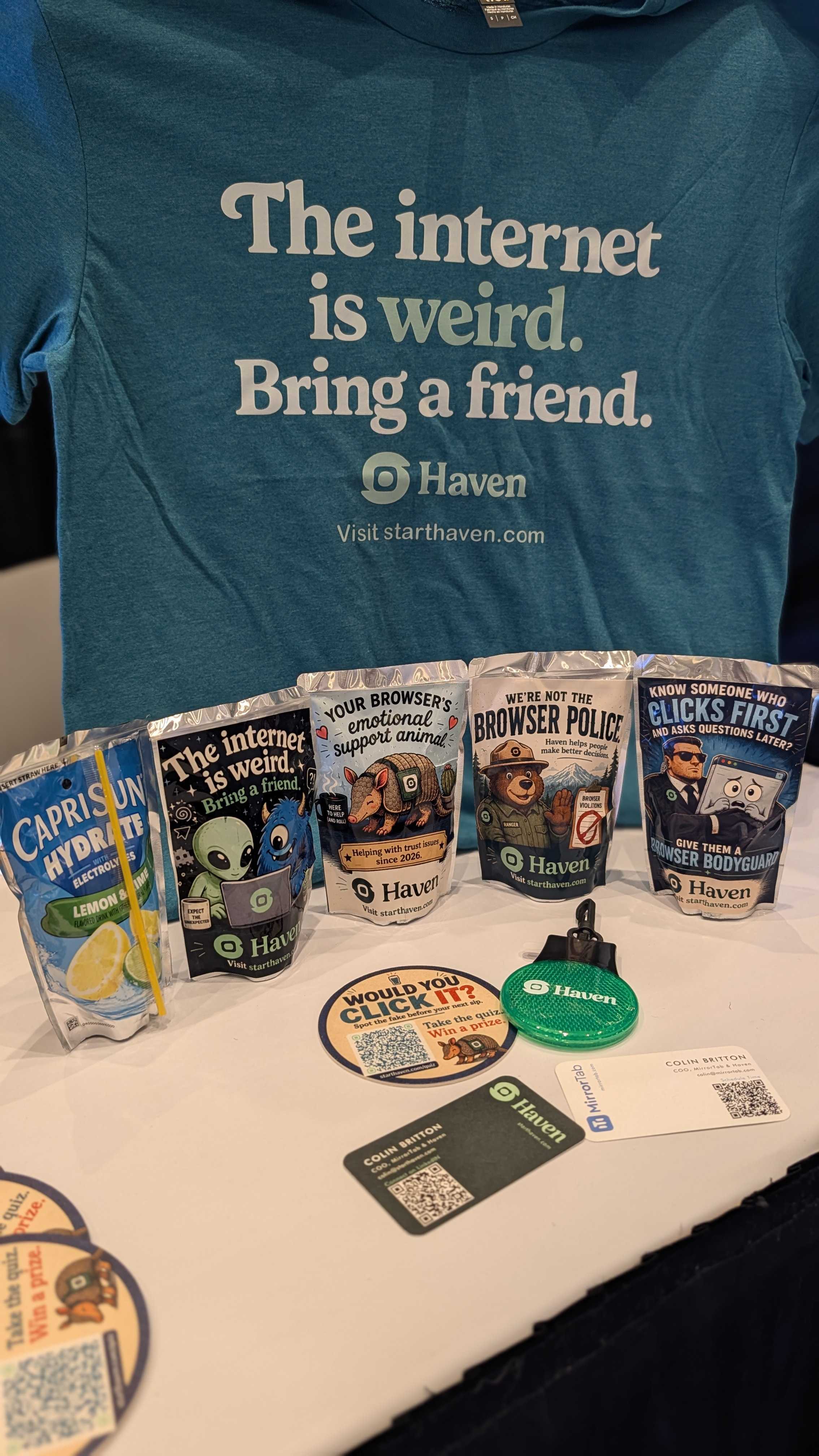 Haven branded merchandise at Flow 2026, including a teal t-shirt, electrolytes, coasters, and stickers